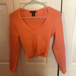 Coral, long sleeve, fits a medium, stretchy